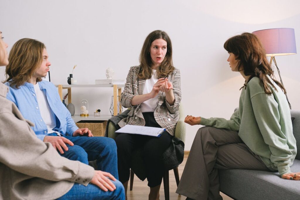 psychotherapist giving advice to group of patients